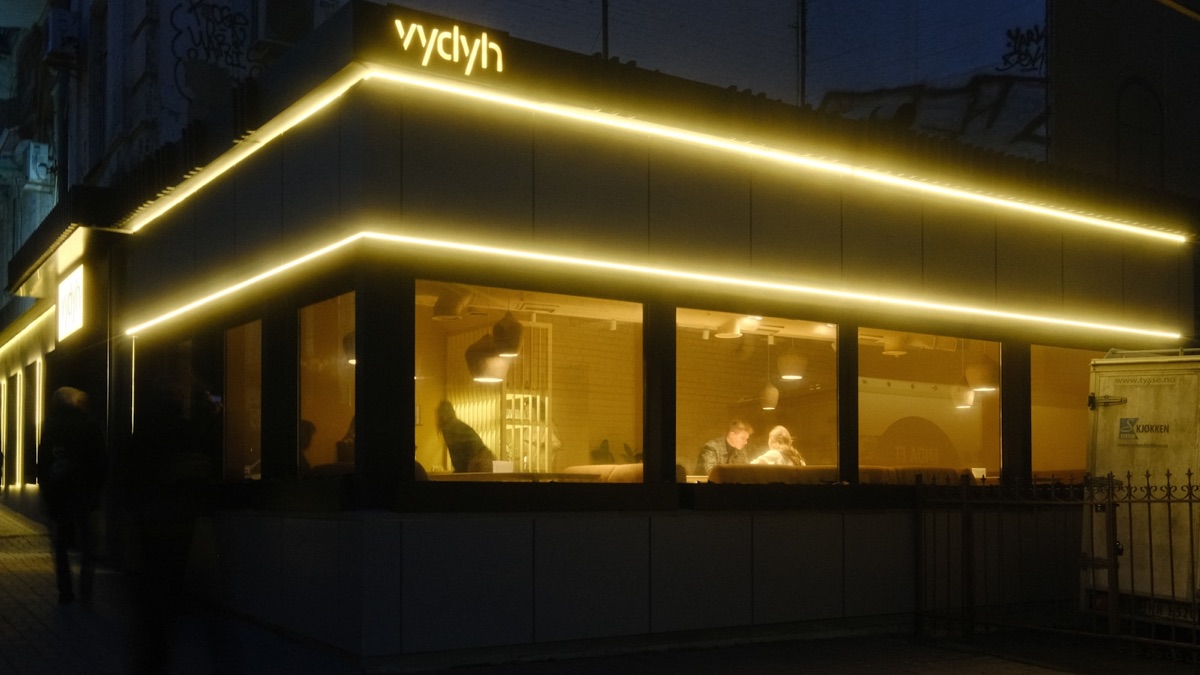 Contemporary hospitality or retail exterior at dusk.